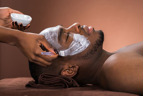 therapist-applying-face-mask-to-man-royalty-free-image-609094134-1547225313.jpeg
