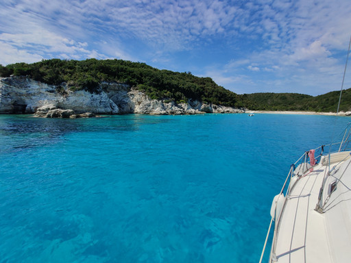 Secluded pebble beach in Paxos accessible only by private boat