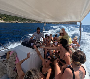 Friends enjoying a private boat day trip from Corfu to Paxos
