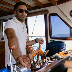 Our captain of the boat on the front deck