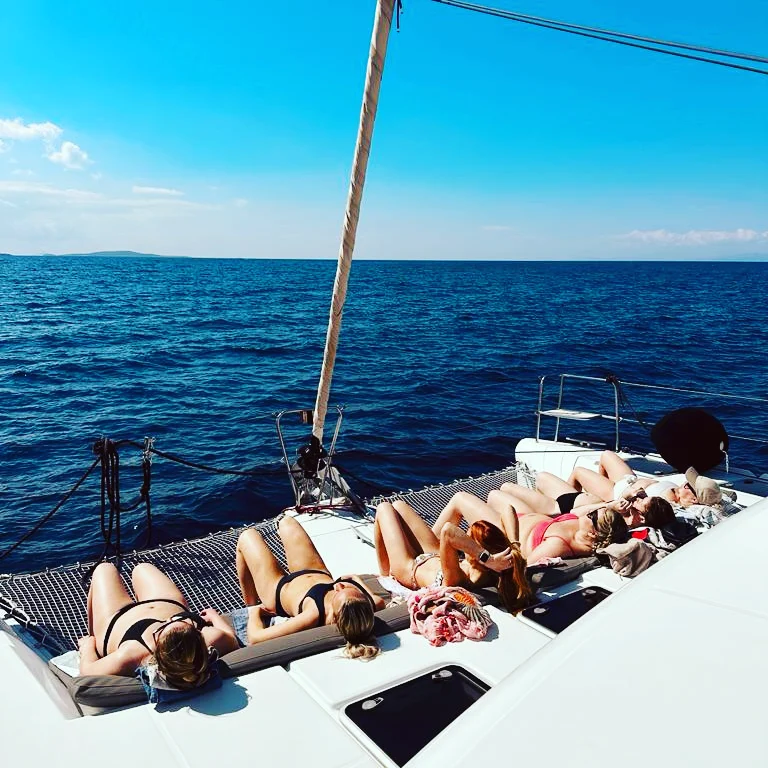 Guests laying on the deck during the cruise