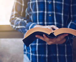 Young-Christian-man-reading-bible-1149069543_4773x3182.jpeg