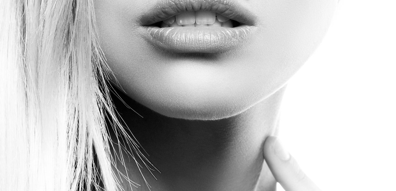 Girl-part-of-face.-Perfect-skin,-beauty-spot,-natural-lips,-nude-make-up.-Black-and-white-