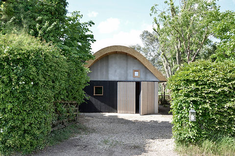Barn-style garden room in Hertfordshire, UK blending modern and rural design in a bold, architectural structure