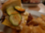 Parson's Chicken Sandwich with pickles coleslaw cheddar cheese and homemade chips