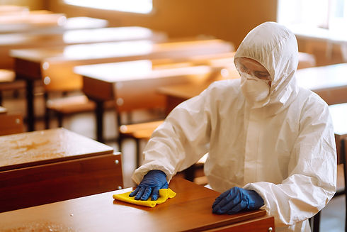 Infection control cleaning man in hazmat