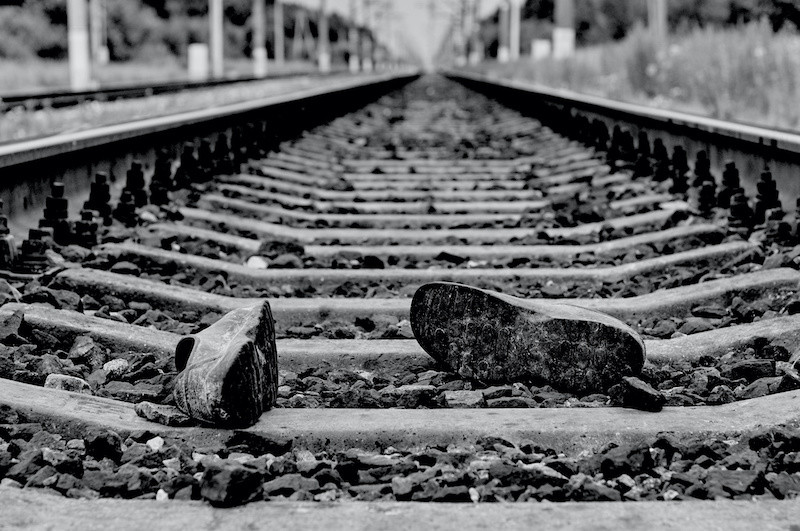 Lost shoes on the rail track indicating a rail fatality