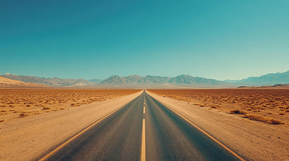 long-desert-highway-stretches-towards-distant-mountains-underneath-a-clear-bright-blue-sky