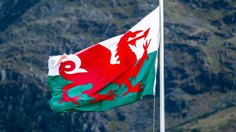 Welsh flag with mountains in the background