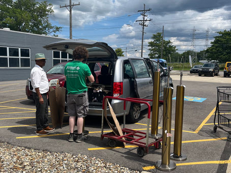 Customer loading their car with their purchases