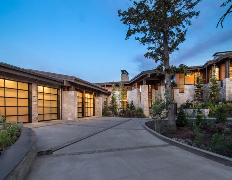 Luxury home at dusk, three-car garage