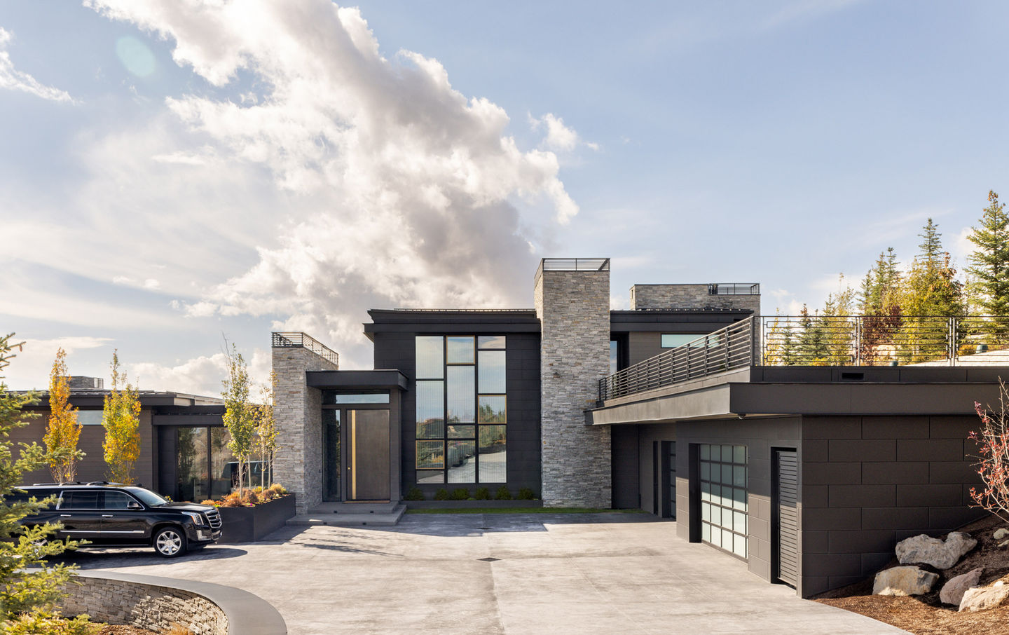 Modern home with stone and glass exterior