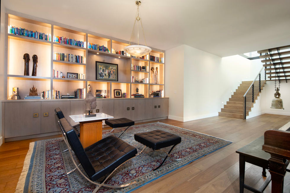 Modern living room with built-in bookcase and seating