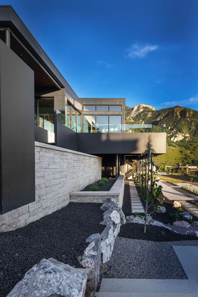 Modern hillside home with stone retaining wall