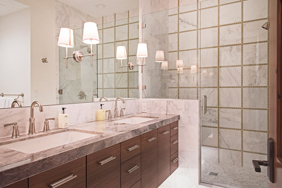 Luxury bathroom with double sinks and glass shower