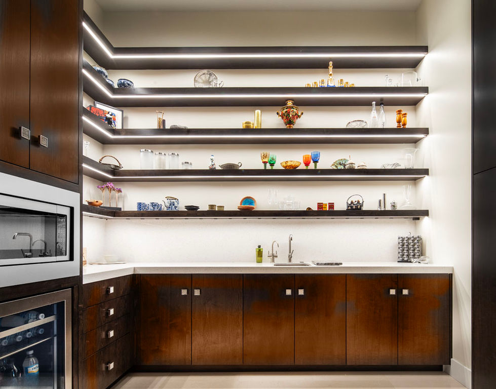 Modern kitchen shelves with glassware and decorative objects