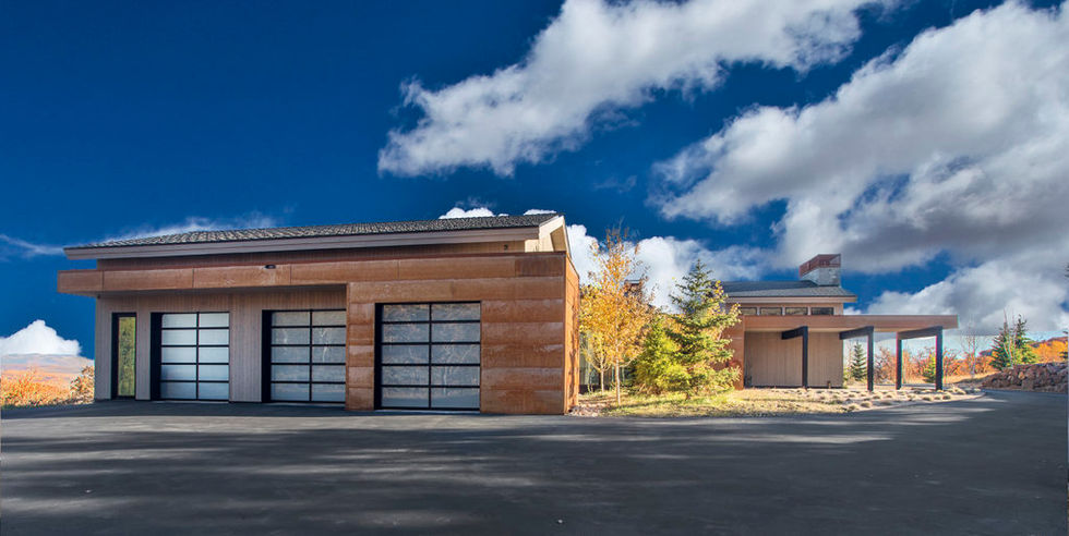 Modern three-car garage, rammed-earth exterior
