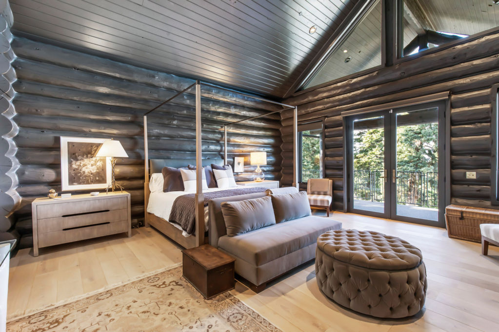 Luxurious log cabin bedroom with a king-size bed