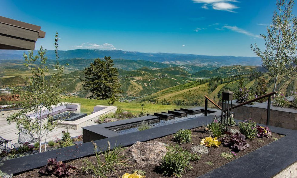 Stunning mountaintop vista with modern water feature