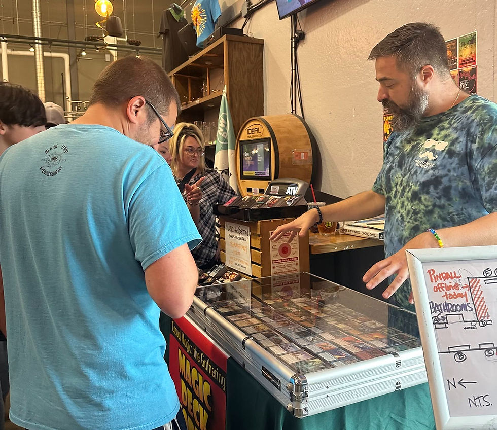 John Streetz, owner of Magic Deck Vortex, talks Magic the Gathering singles with a patron at the 2025 event - photo by Streetz Artz Alliance