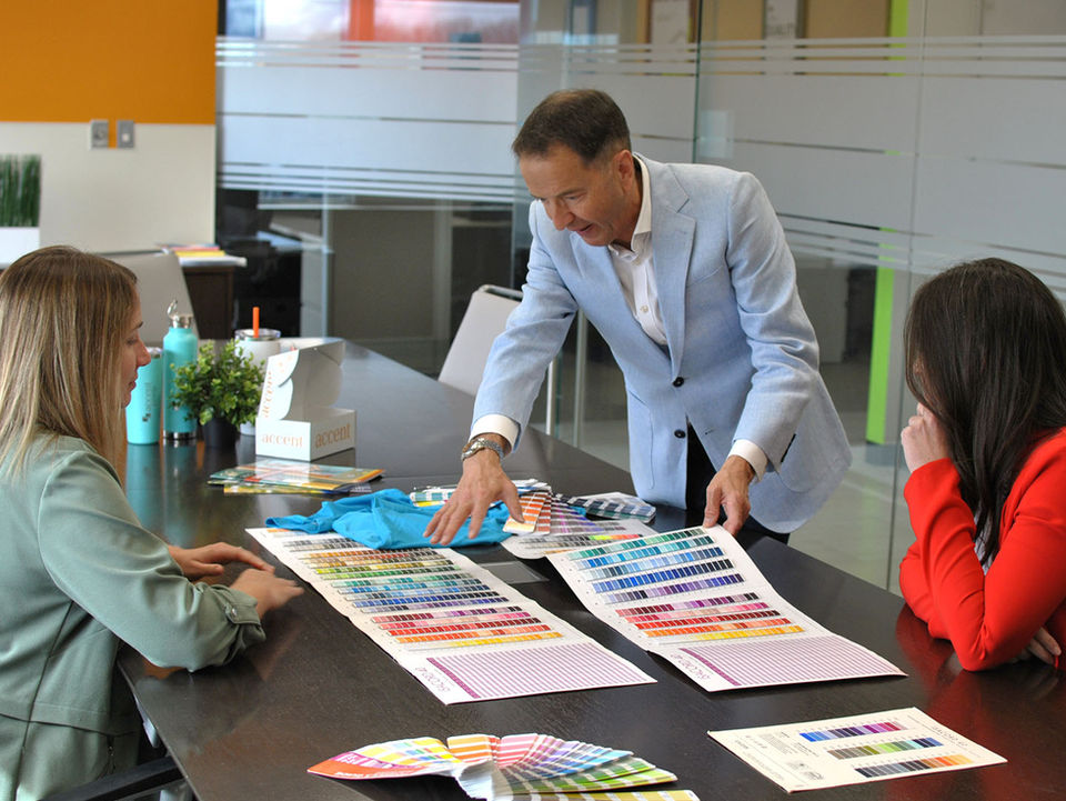 Team of designers looking over colour ideas for a product range