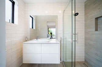 Beautiful small tiled bathroom with custom made vanity