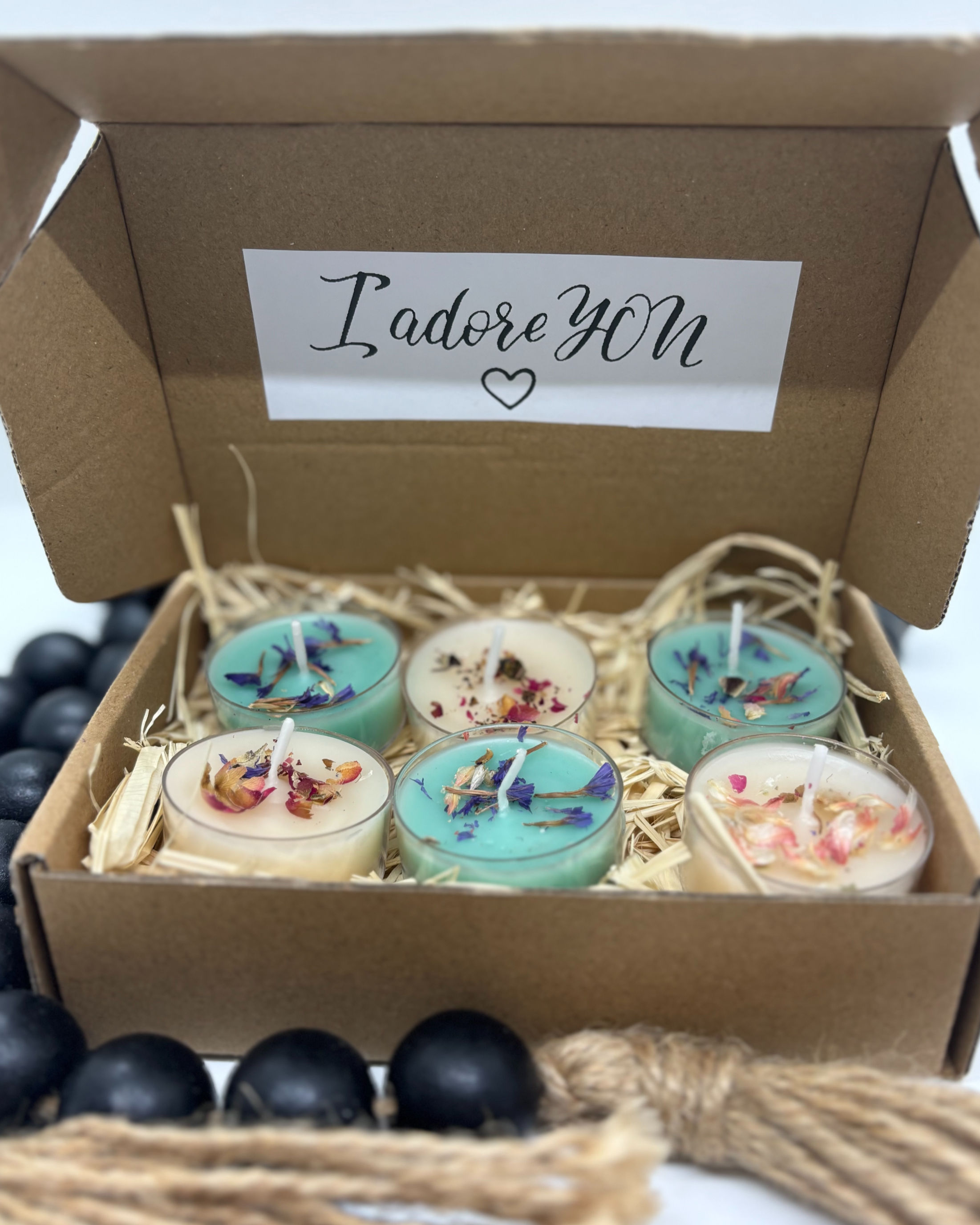 a box of six sample tea lights.