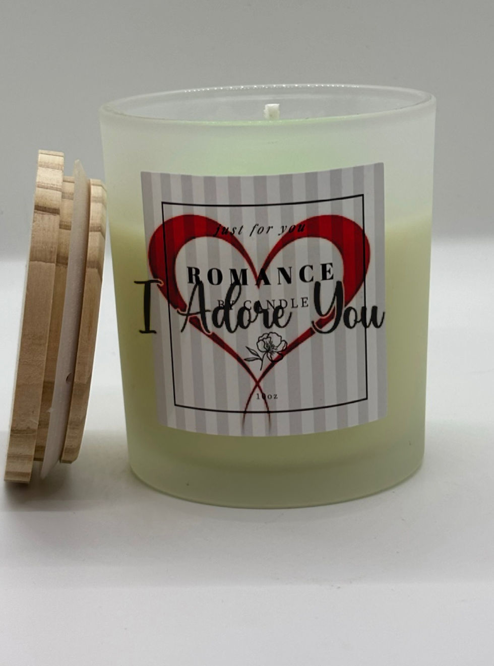 a candle in a clear jar