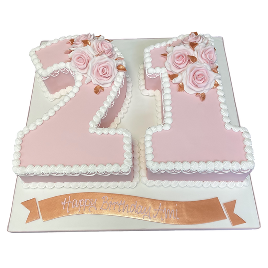 Bespoke number 21 cake adorned with pink and white roses, crafted in Solihull, West Midlands for celebration.