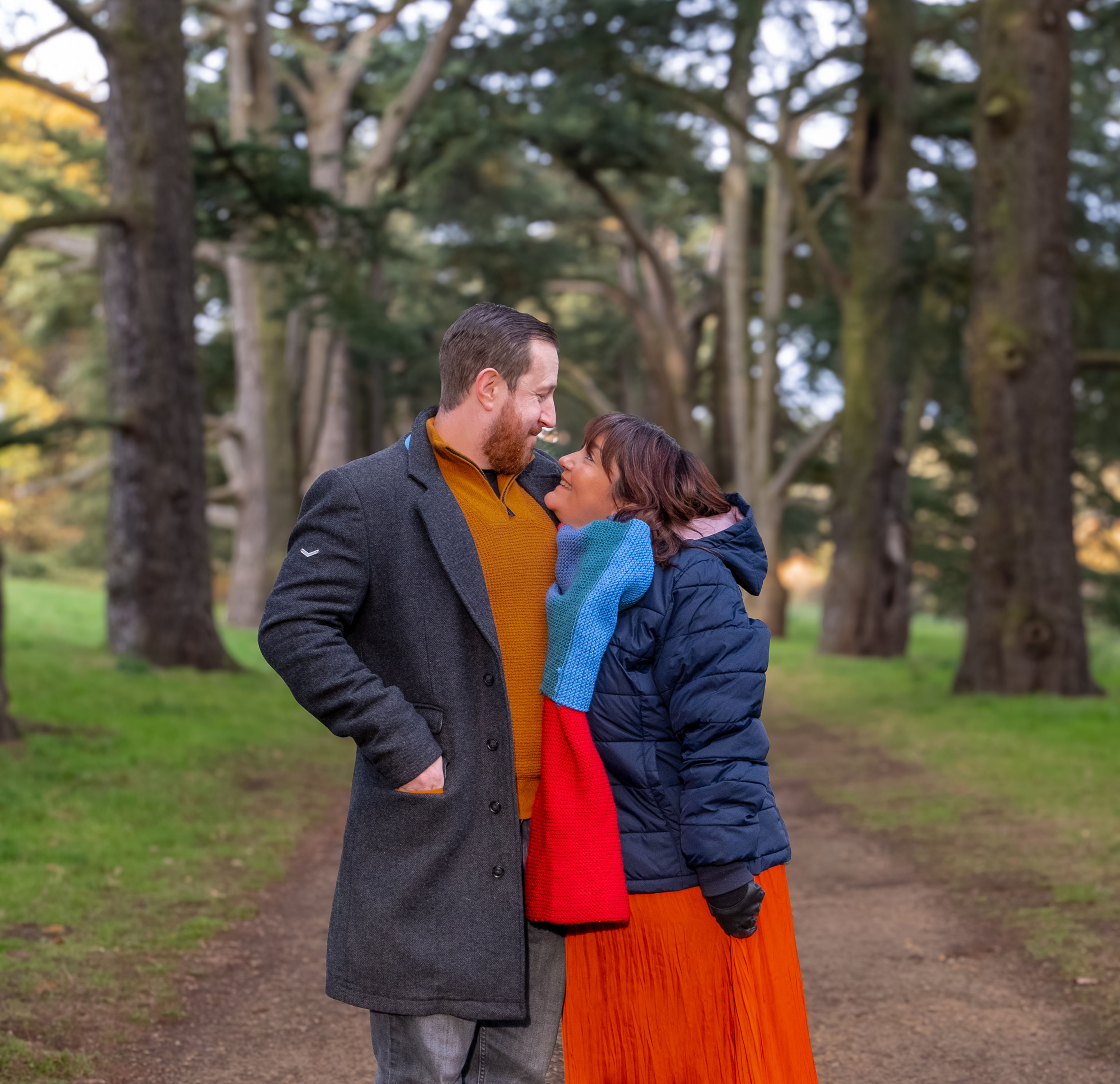 Happy newly engaged couple staring into each others eyes