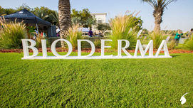 An outdoor family day event setup with client name written in large