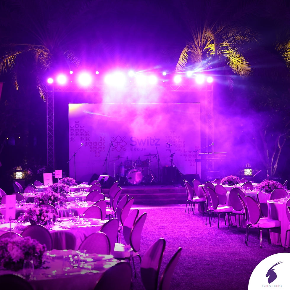 A beautifully arranged tablescape at a corporate dinner, featuring branded centerpieces, custom tableware, and ambient lighting that enhances the event's sophisticated atmosphere.