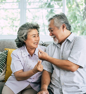 senior-couple-playing-together-living-room.jpg