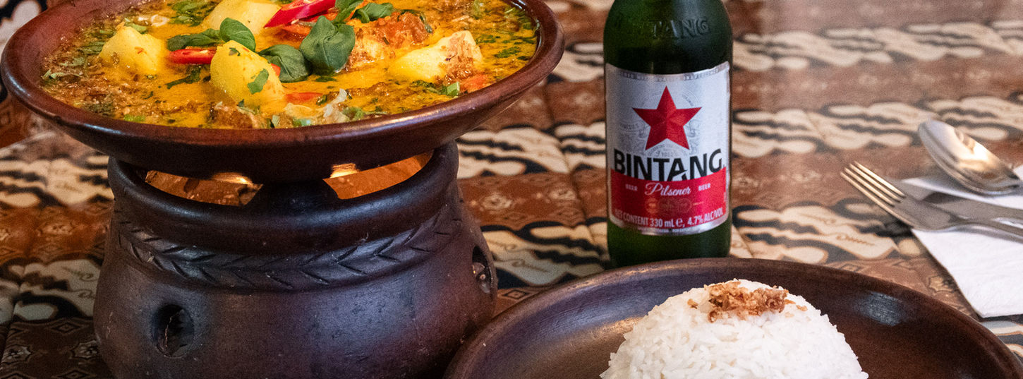 Monkfish curry with coconut sauce served with jasmine rice at Bali Satay House Indonesian restaurant in Barnet.