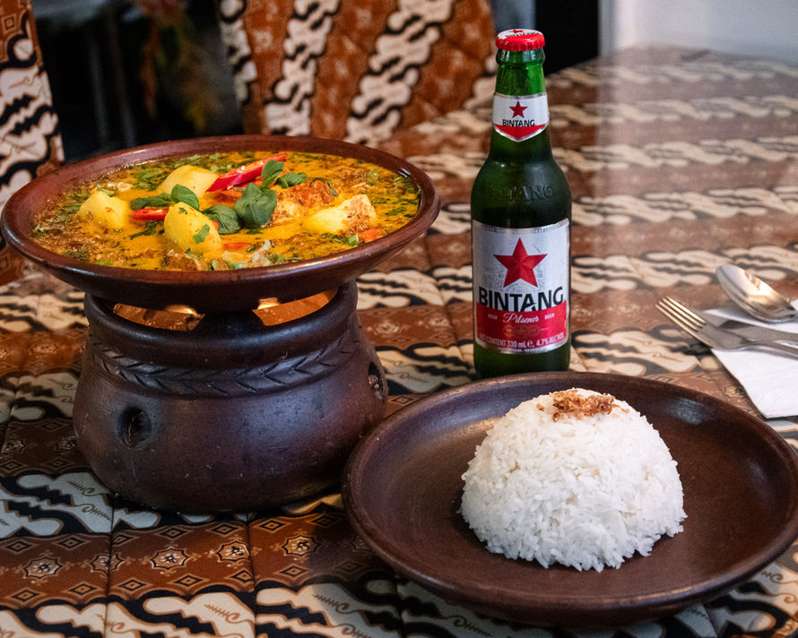 Monkfish curry with coconut sauce served with jasmine rice at Bali Satay House Indonesian restaurant in Barnet.