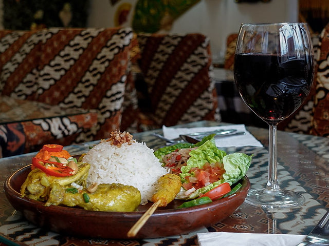 Nasi Campur Bali served with steamed rice, grilled and slow-cooked Indonesian dishes, sambal, and fresh elements at a family-run Indonesian restaurant in Barnet, London.