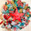Thumbnail: 24” diameter by 9” deep Christmas wreath created with poly deco mesh snd poly ju