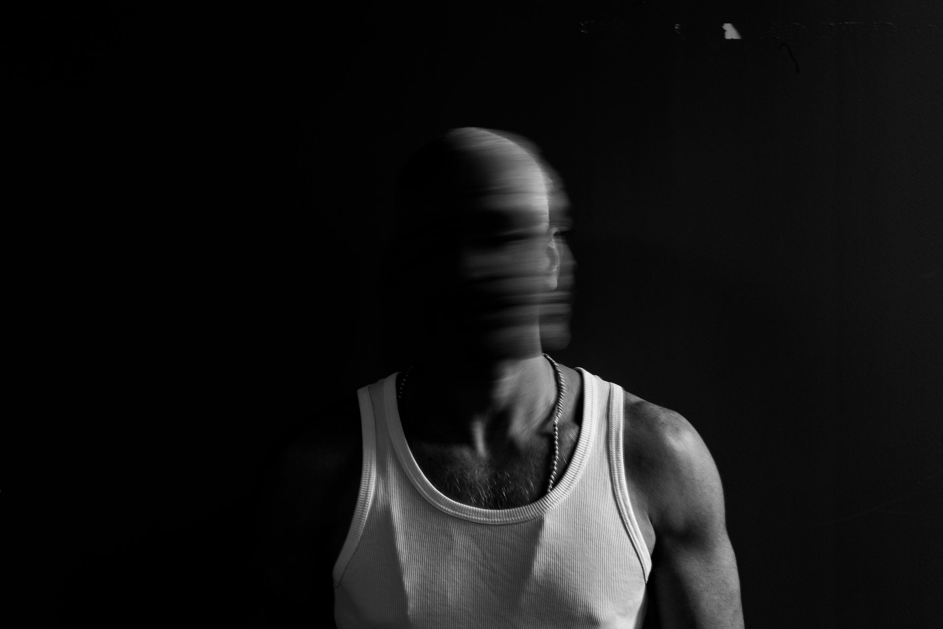 Black and white man, motion-blurred face
