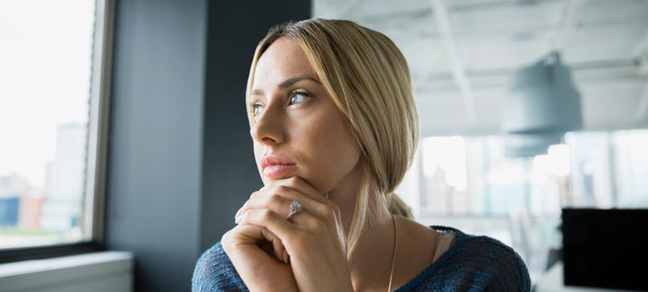 pensive-businesswoman-looking-out-office-window-2026-03-26-05-10-08-utc copy.jpg