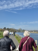 Women exploring Amble Harbour, Northumberland seaside town, scenic coastal walk, independent shops and waterfront views in “The Friendliest Port