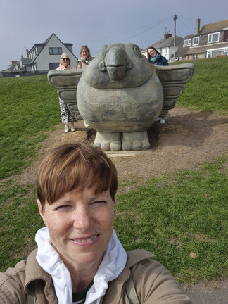 Women exploring Amble Harbour, Northumberland seaside town, scenic coastal walk, independent shops and waterfront views in “The Friendliest Port