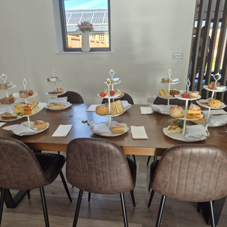 Girls weekend arrival at The Galloway in West Chevington, Northumberland, setting up afternoon tea with pastries and fizz, cosy countryside holiday home with hot tub.