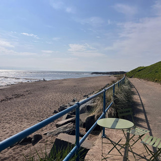 Girls weekend wellness experience at Café Needles Eye on the Northumberland seafront, sauna sessions and cold-water sea dips with coastal views.