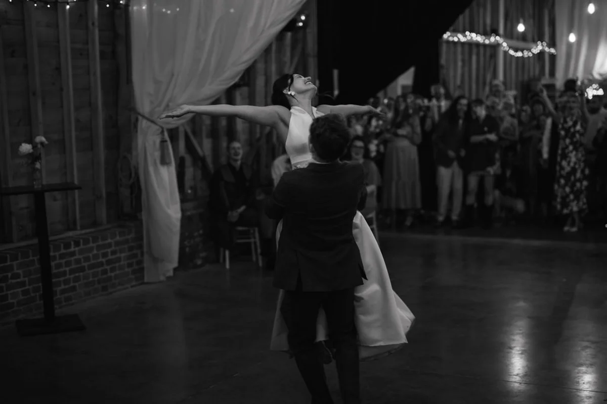 A couple dance of their wedding day. Black and white wedding photography by Suffolk wedding photographer Mikaela Jade.
