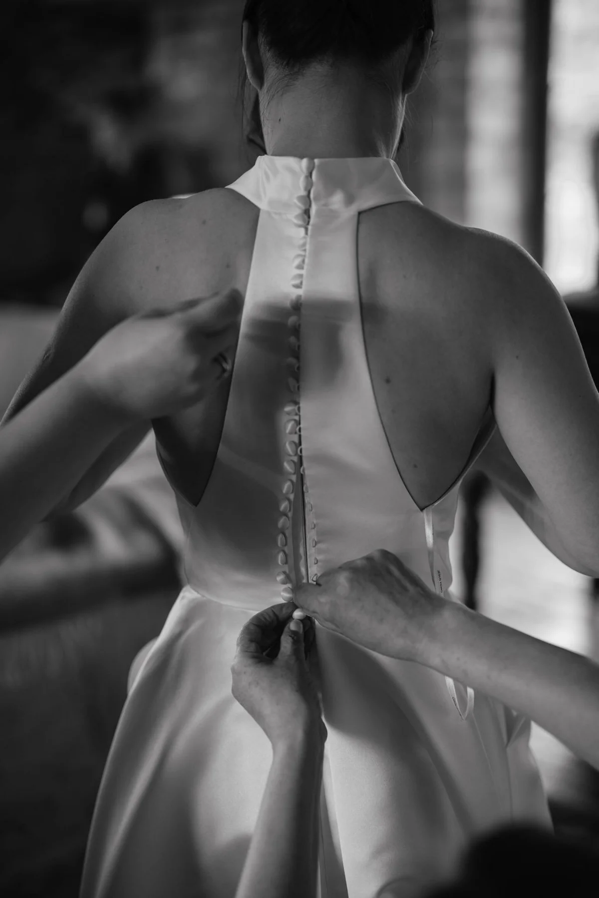 A bride gets ready at Childerley Estates in Cambridge. Black and white wedding photography by Mikaela Jade.