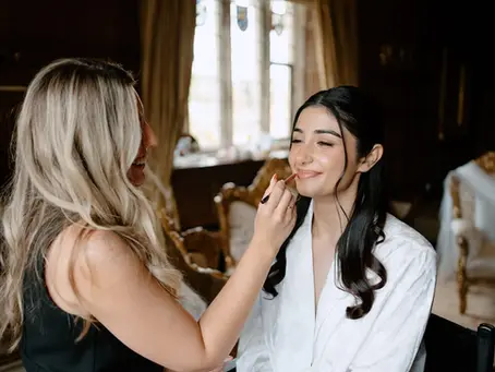 Suffolk bridal makeup artist Emily Chantal preps a bride on her wedding day.
