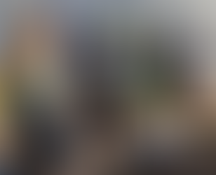 Group of people outdoors looking in compost bins