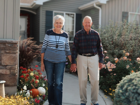 Elderly couple wearing their medical alert button on a necklace
