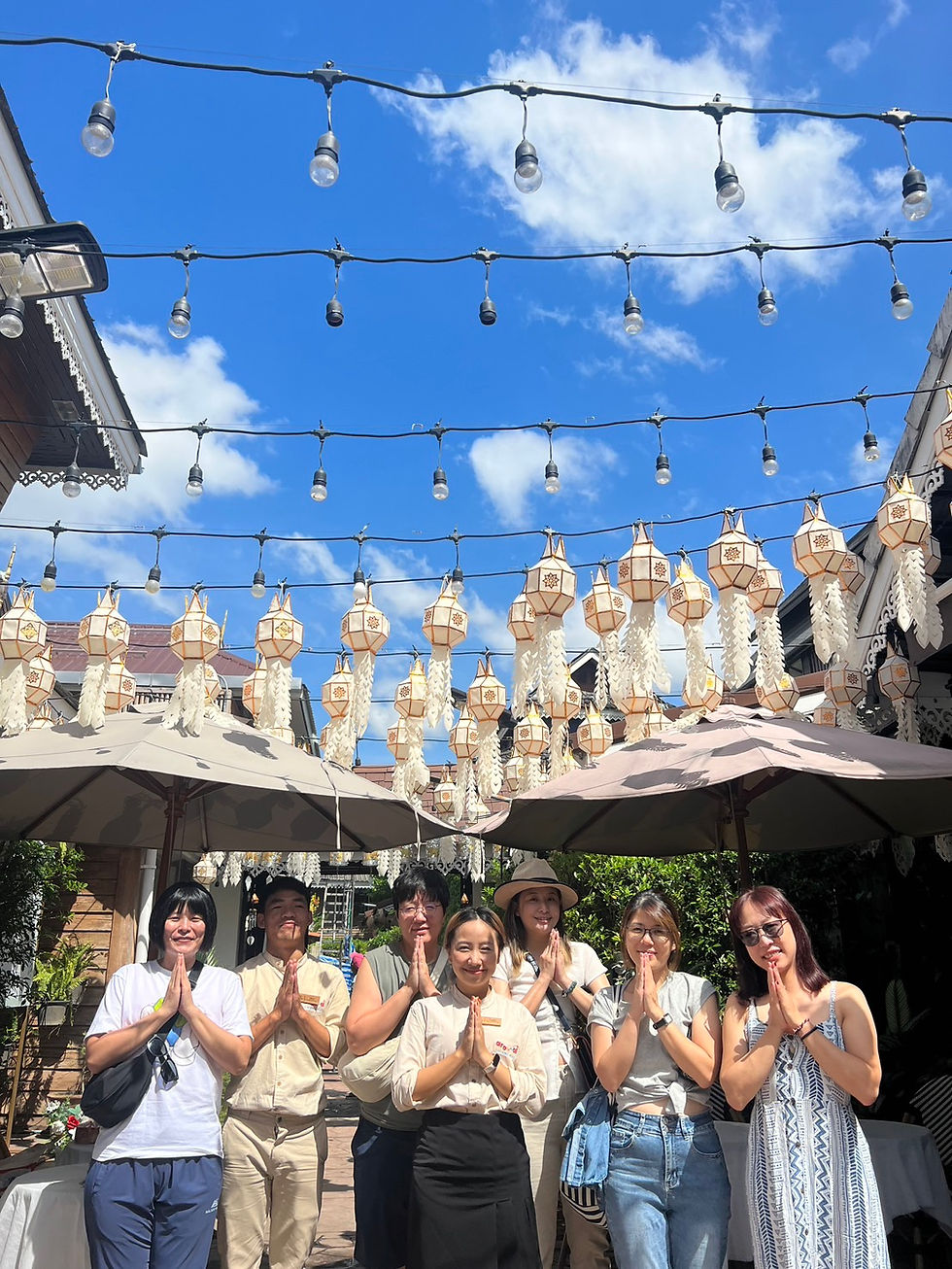 Friendly Buri Gallery House staff welcoming guests for check-in
