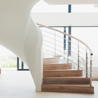 White and wooden spiral shape stairs